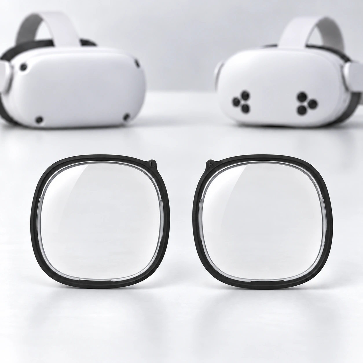 White Meta Quest headsets with two black lens inserts displayed in front