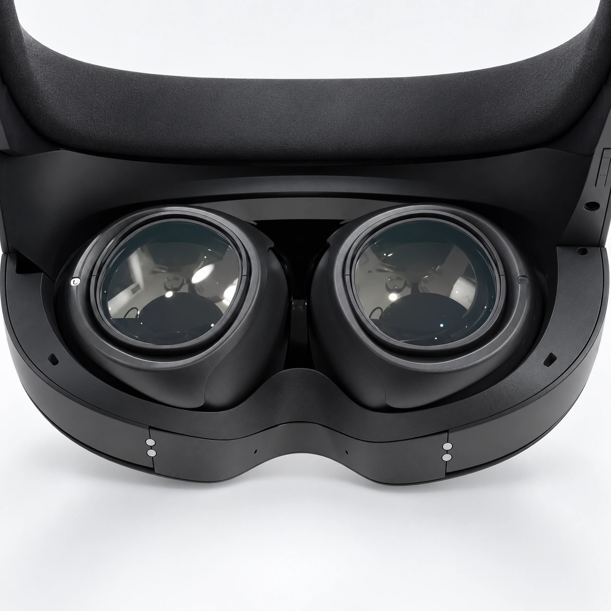 Close-up of two dark lenses inside a black VR headset