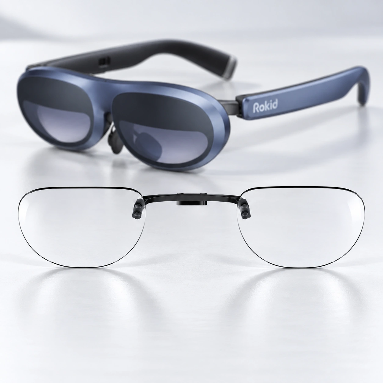 Blue Rokid glasses with a clear lens insert displayed below