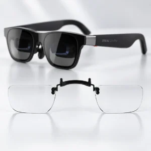 Black XREAL glasses with a clear lens insert displayed below